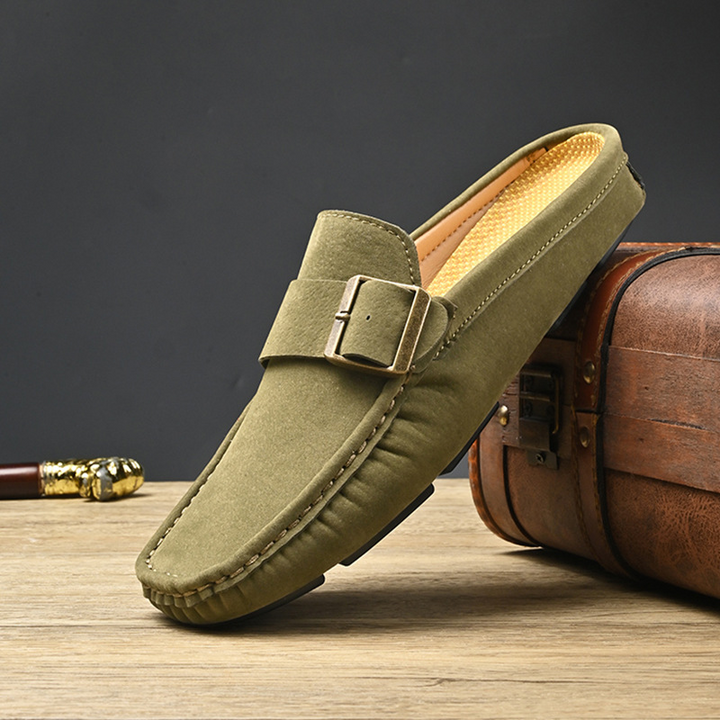 Olive suede loafers with gold buckle strap and moc toe stitching