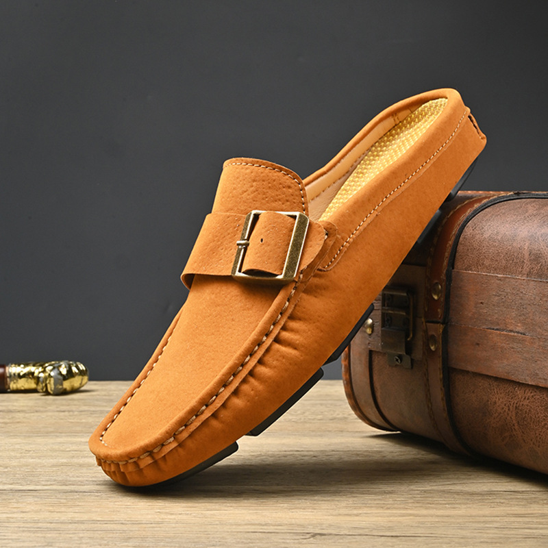 Tan suede loafers with square metal buckle strap and stitched edges