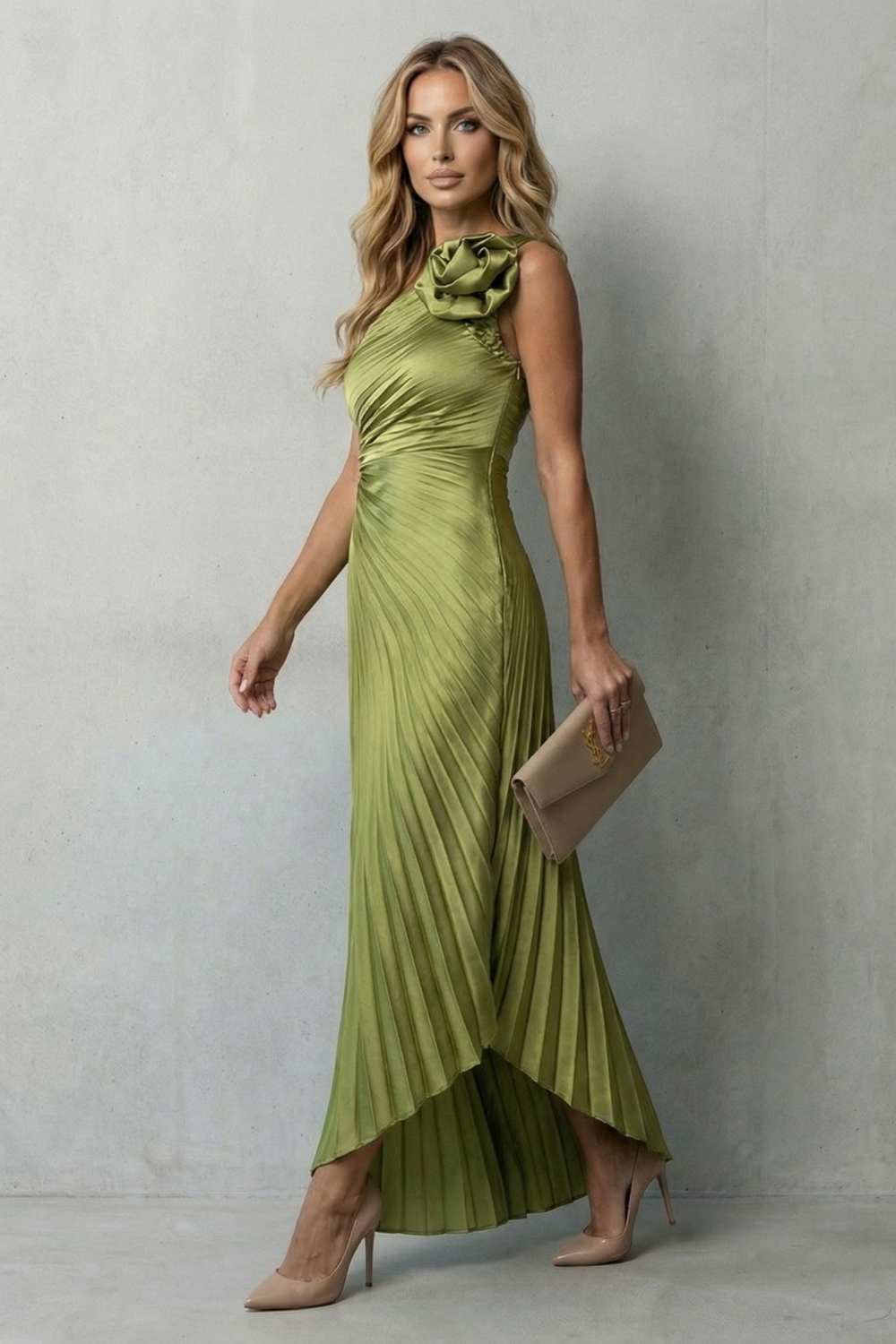 Green pleated sleeveless maxi dress with ruched side detail and asymmetric hem.