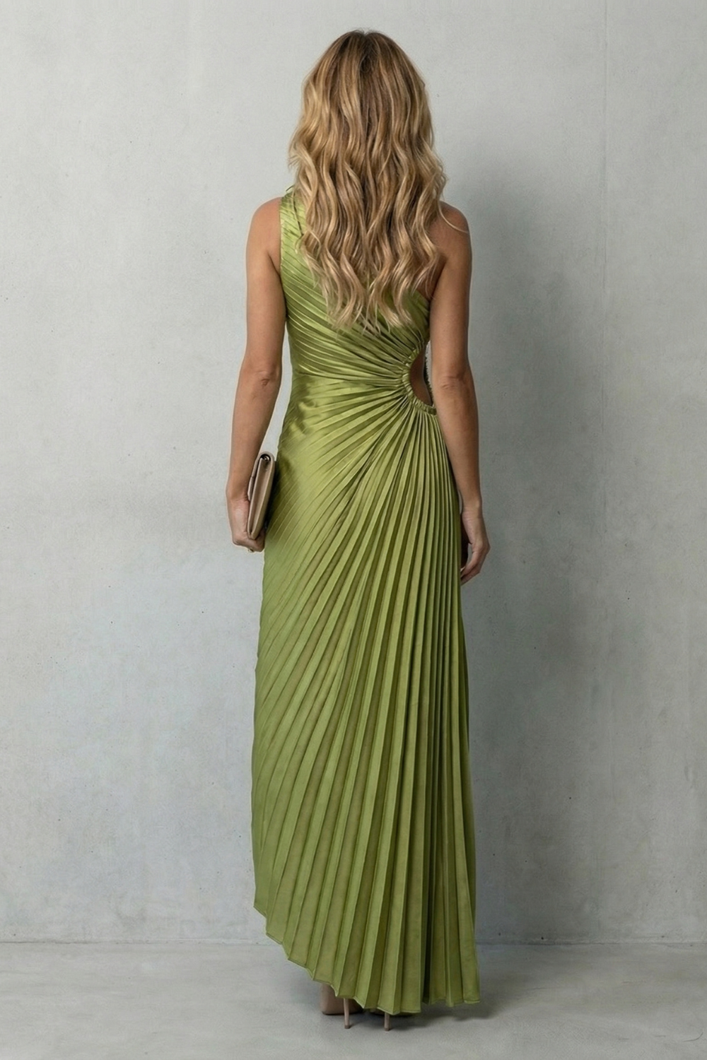 Back view of green pleated sleeveless maxi dress with gathered waist ruching.