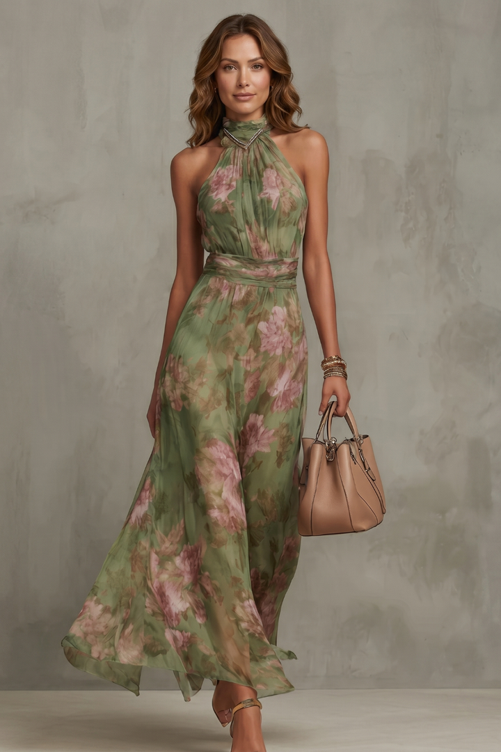 Green floral halter maxi dress with fitted waist and flowing skirt