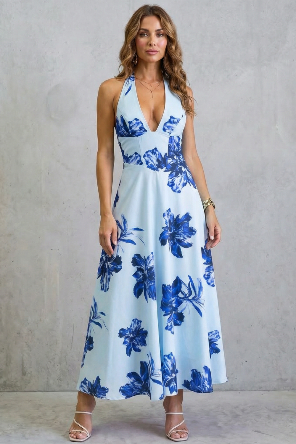 Blue floral backless maxi dress with deep V neckline and thin straps
