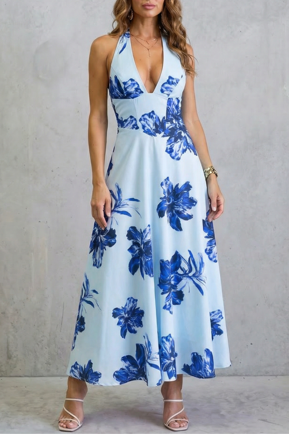 Blue floral maxi dress with deep V neckline and thin straps