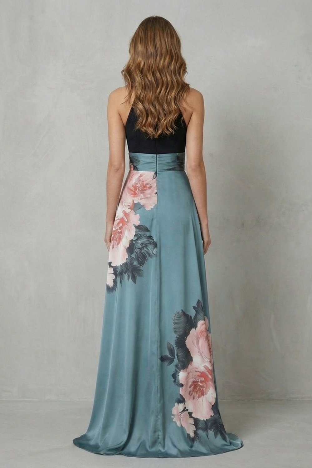 Halter maxi dress, back view: black neck with teal skirt and floral accents.