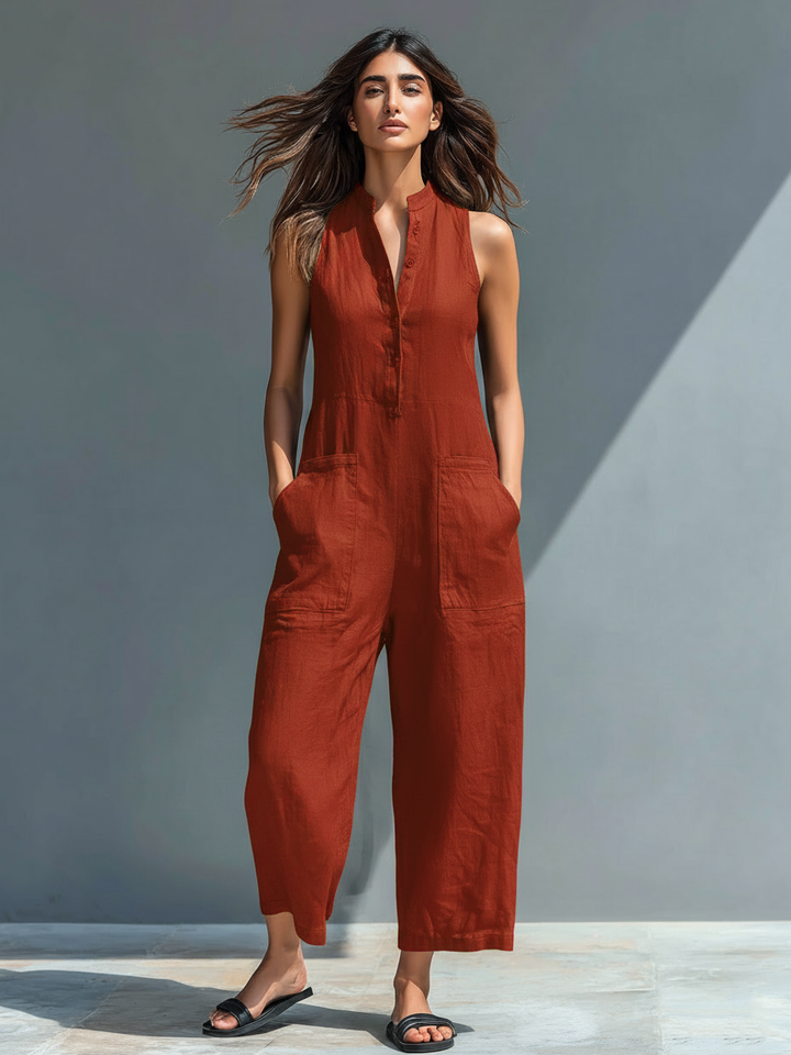 Sleeveless utility jumpsuit, rust red, button-front with patch pockets and wide ankle-length legs