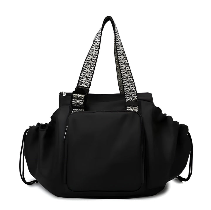 Black 3-in-1 organized tote bag with front pocket, ruffled sides, and patterned shoulder straps
