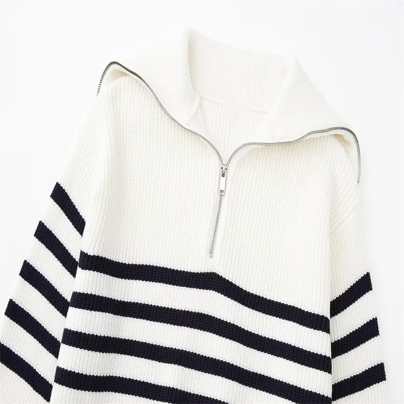 White knit quarter-zip sweater with metal zipper and navy striped chest band