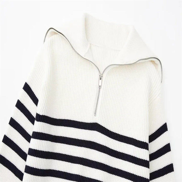 White knit quarter-zip sweater with metal zipper and navy striped chest band