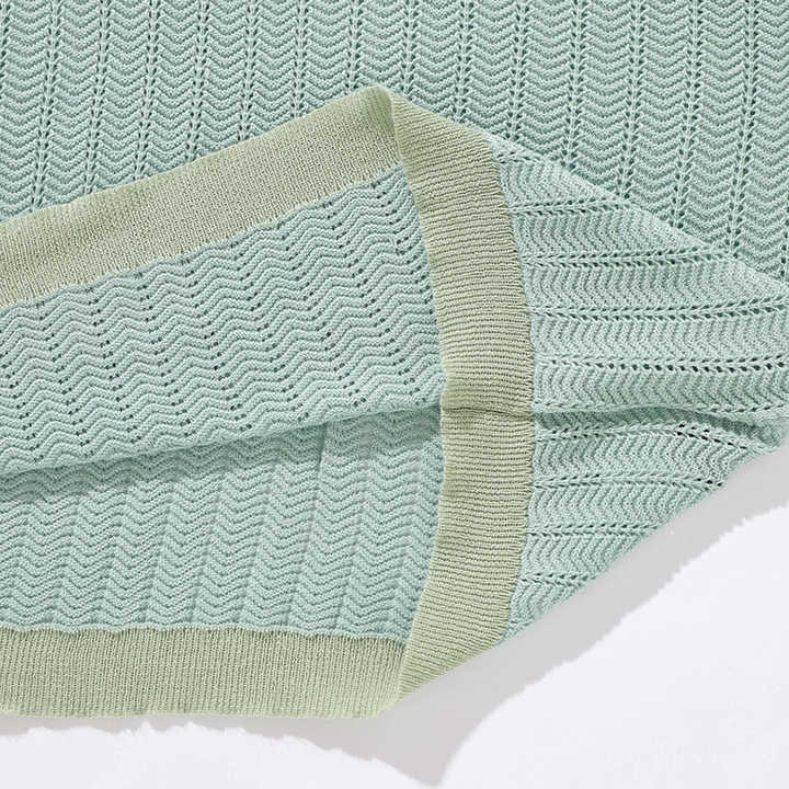 Mint knit polo hem detail with textured knit and ribbed trim
