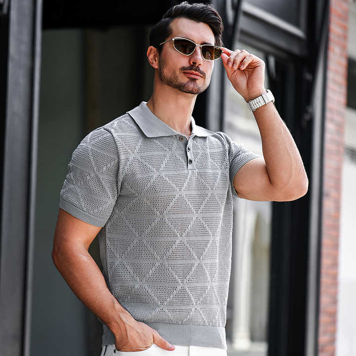 Mens grey knitted polo shirt with textured geometric pattern and ribbed collar