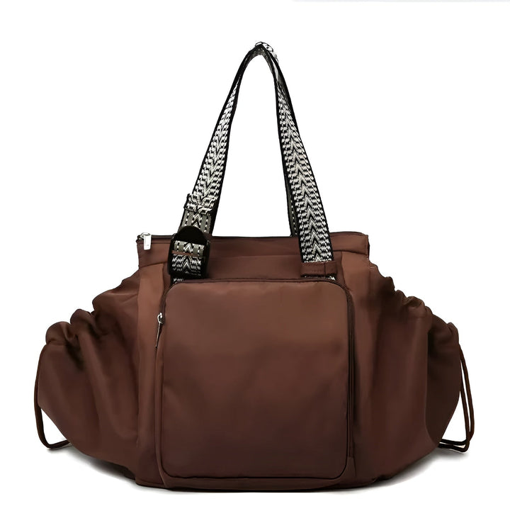 Brown 3-in-1 organized tote bag with front pocket, ruffled sides, and patterned shoulder straps