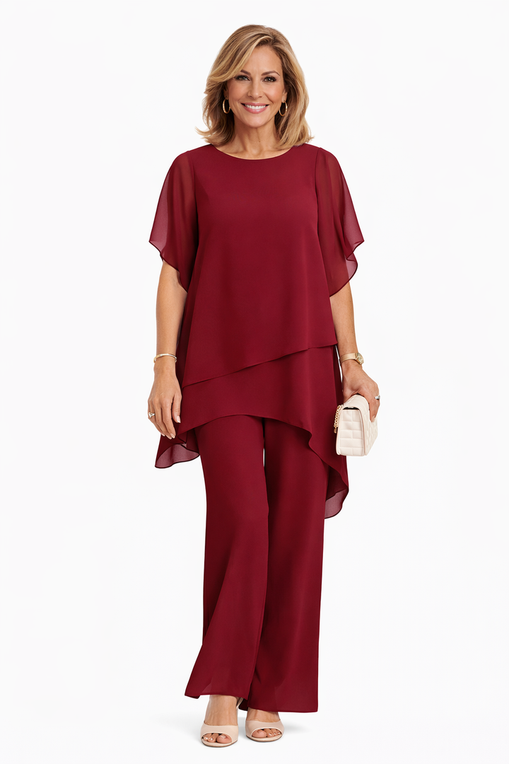 Layered chiffon two-piece set in deep red: draped tunic overlay and wide-leg pants