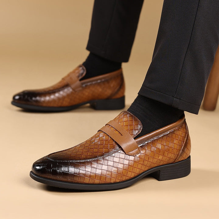 Brown woven slip-on business shoe with cross strap, low heel, and rounded toe