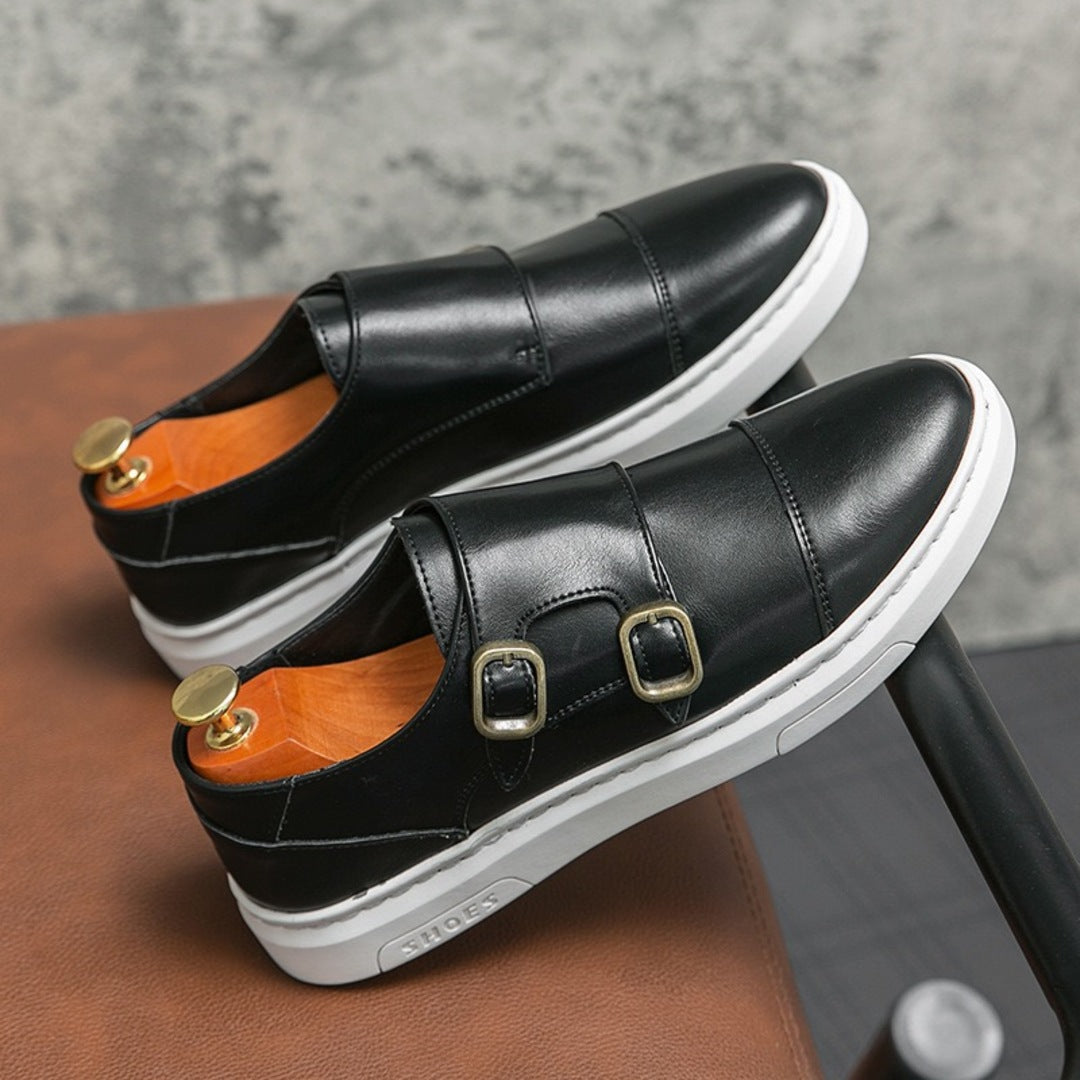 Black strap sneakers with double buckle details and white rubber sole
