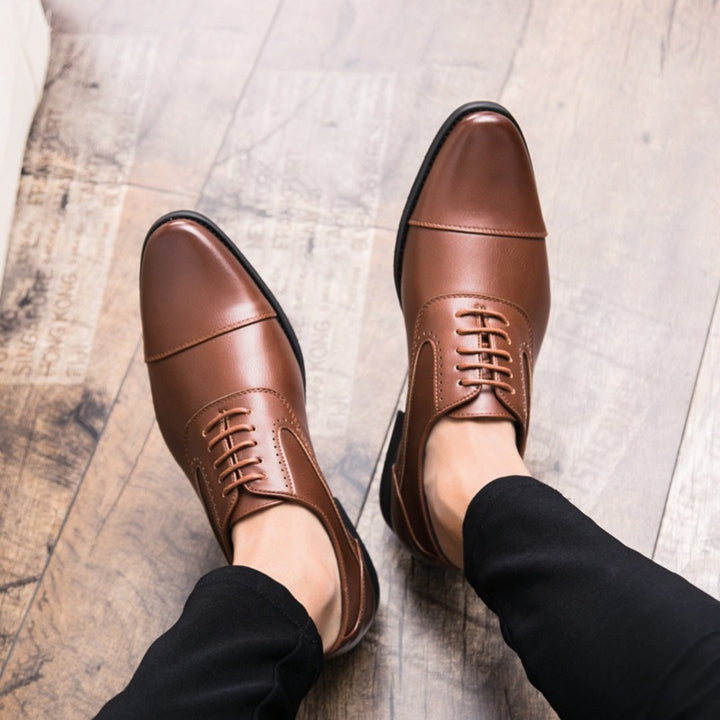 Brown lace-up oxford shoes with plain toe and cushioned sole