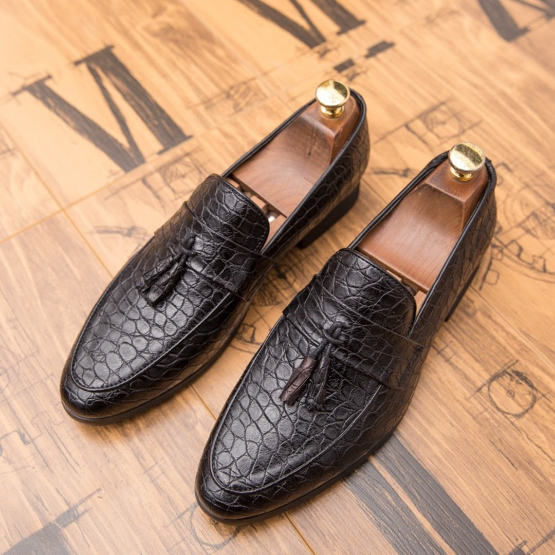 Black croc loafers with tassel detail and metal heel tabs