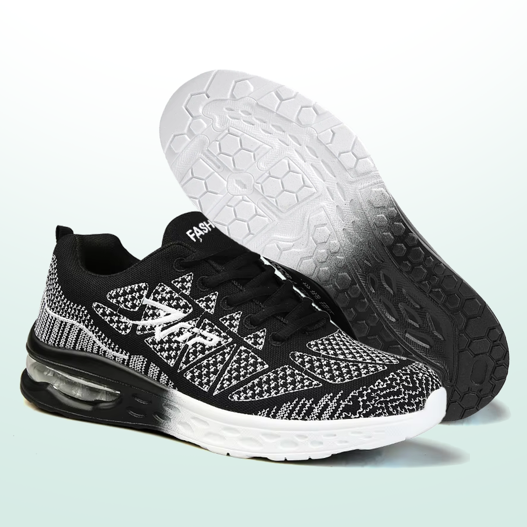 Black-and-white lace-up walking sneakers with hex-grip outsole and cushioned air sole