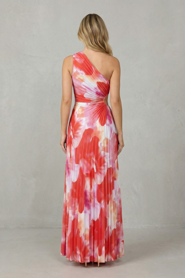 Back view of red and white printed one-shoulder maxi dress with tie waist
