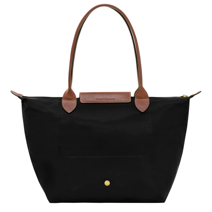Longchamp medium tote in black with tan handles, front pocket and gold snap details