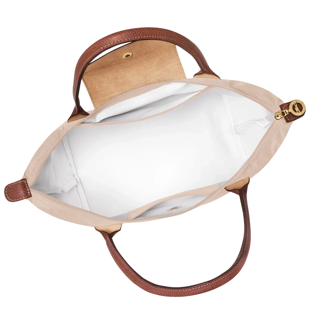 Medium Le Pliage tote open interior in paper canvas with brown leather trim and snap button