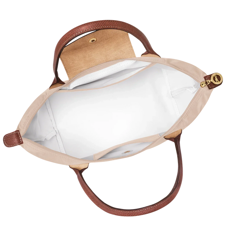 Medium Le Pliage tote open interior in paper canvas with brown leather trim and snap button