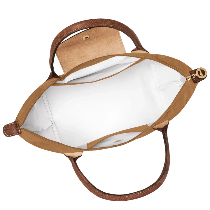 Open fawn tote bag with fabric lining, leather trim, and snap button