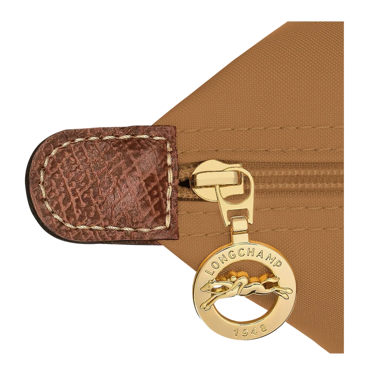 Longchamp charm with gold clip on brown fabric strap