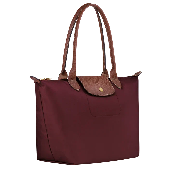 Medium tote bag by Longchamp in burgundy with snap front pocket and side wings
