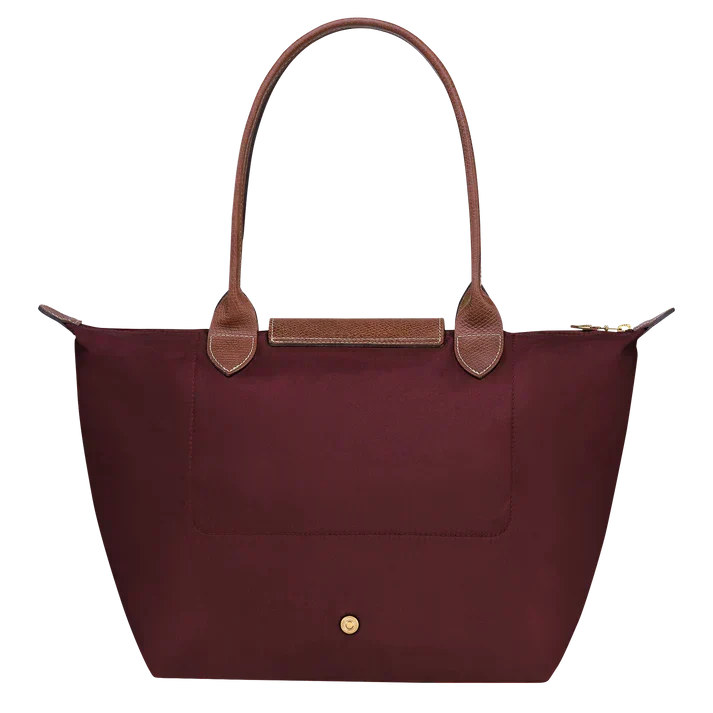 Medium tote bag by Longchamp in burgundy with top handles and center snap