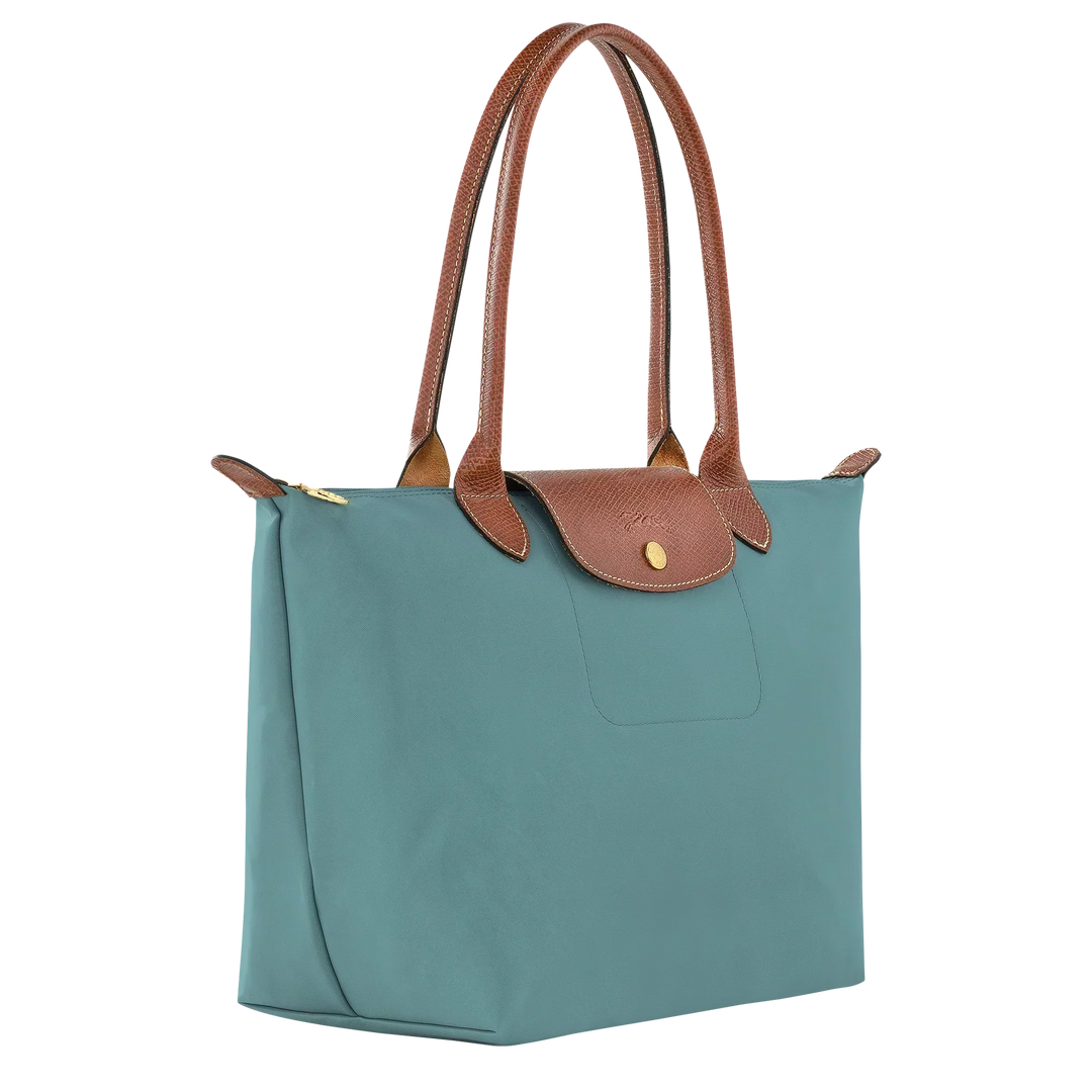 Longchamp Le Pliage medium tote, side view, eucalyptus blue with leather top handles
