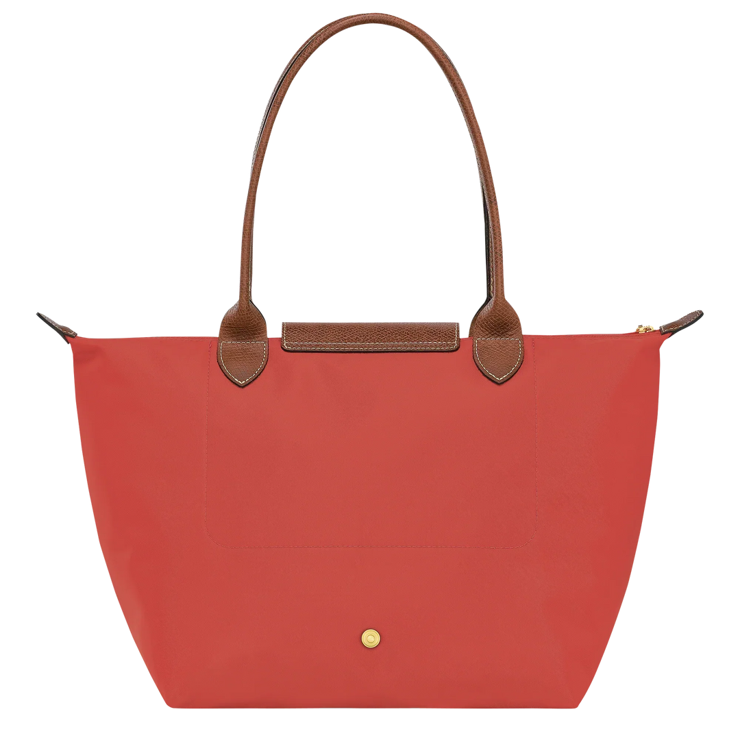 Tomato red medium tote with brown leather top strap, front flap pocket and gold button