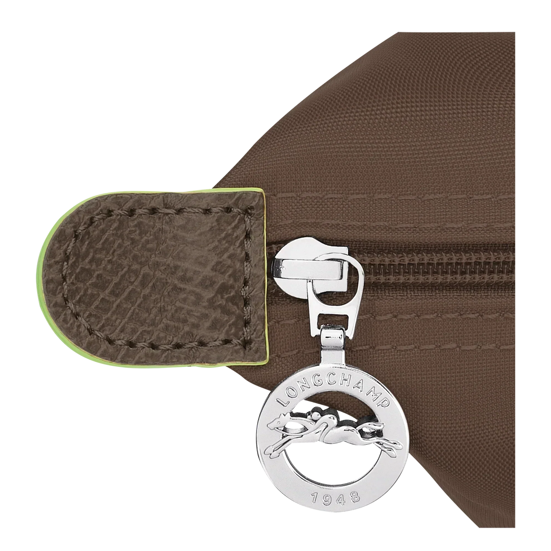 Longchamp Medium Le Pliage tote detail: metal key fob logo on terra strap