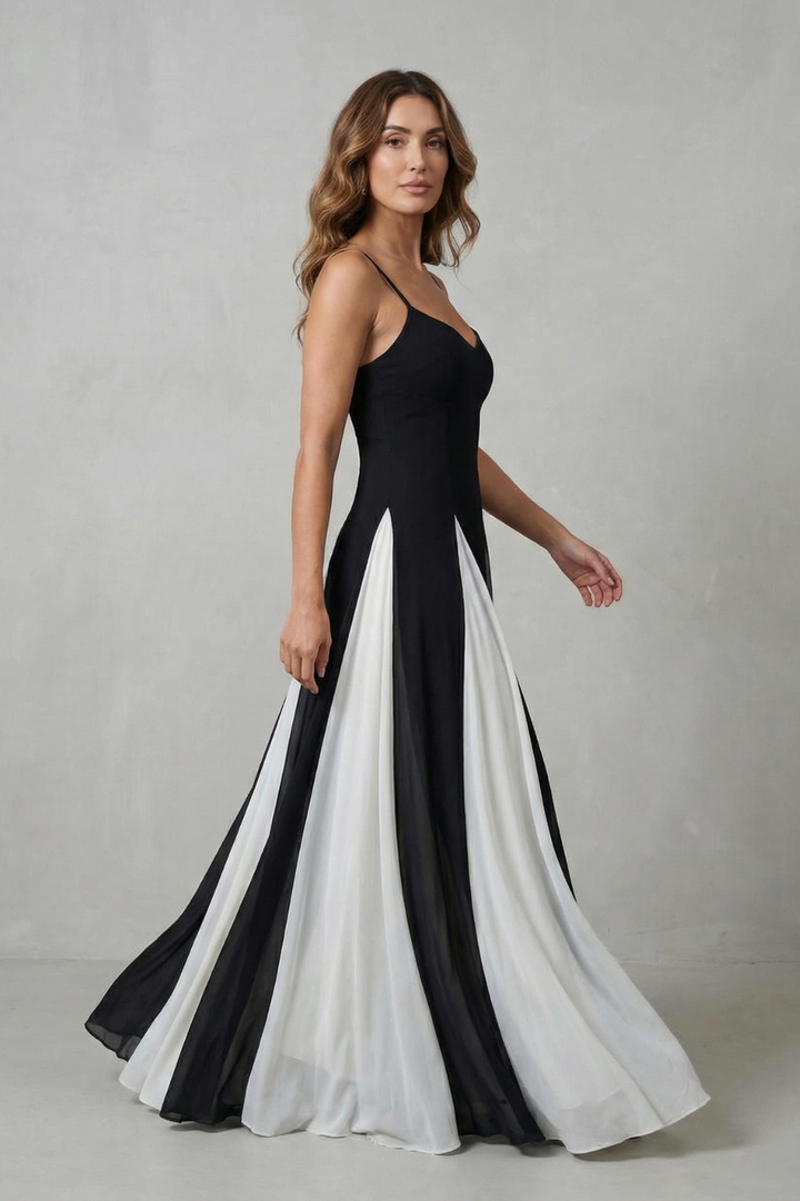 Contrast maxi dress with spaghetti straps, flared skirt; black bodice with white lower panels