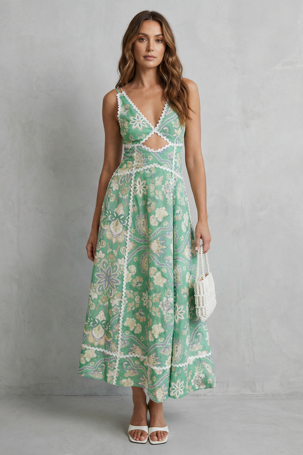 Cut-out maxi dress in mint green with white floral print, V-neck and lace trim
