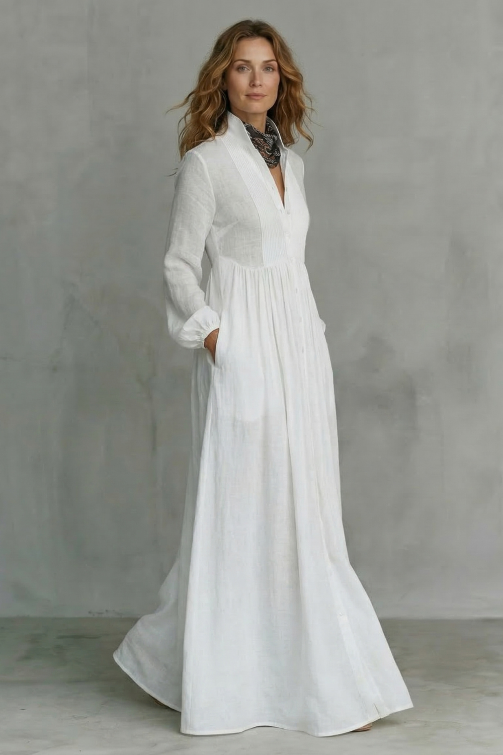 White mandarin-collar button-front maxi dress with long sleeves and gathered waist