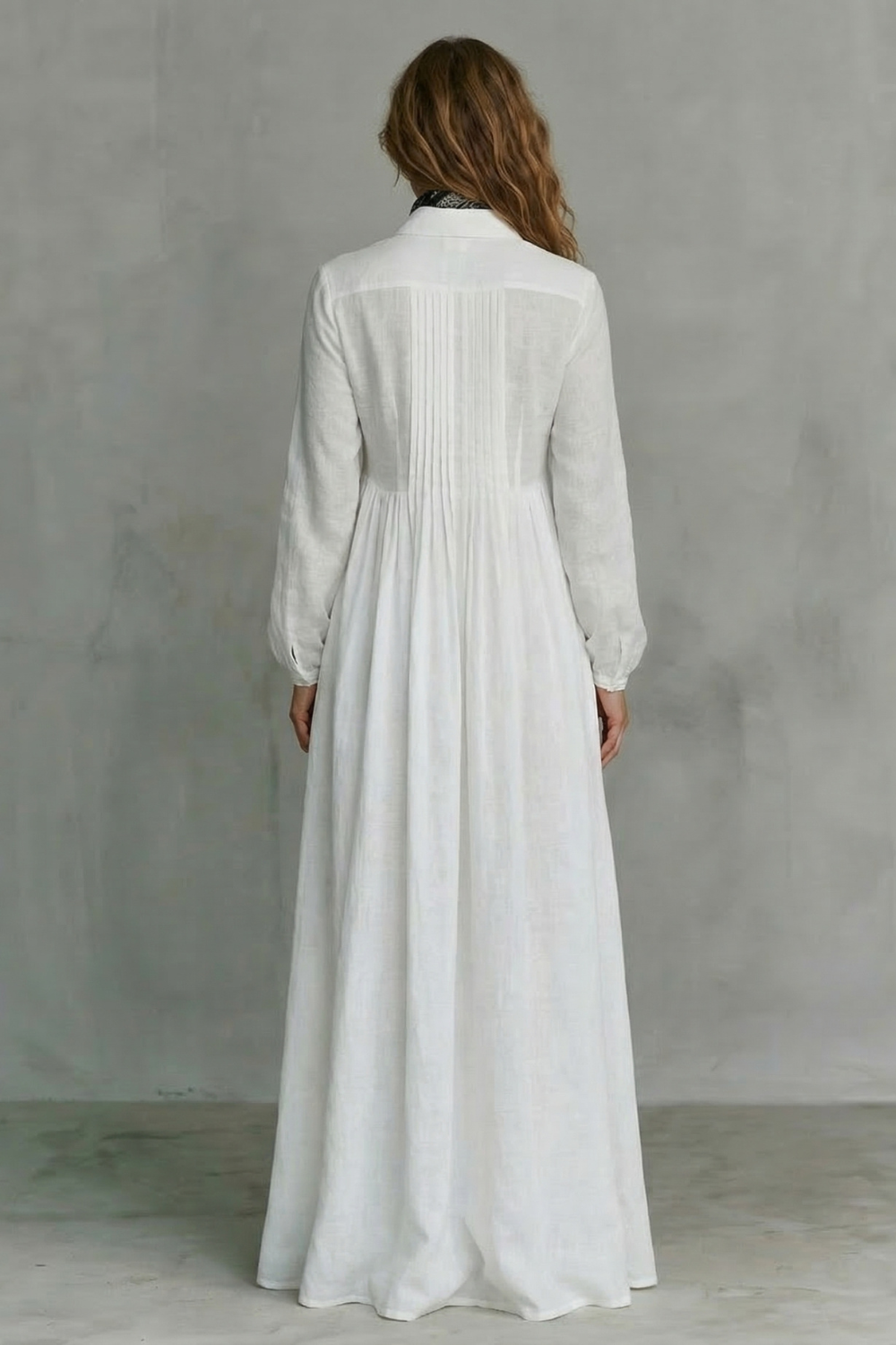 White mandarin-collar maxi dress with long sleeves and gathered back yoke