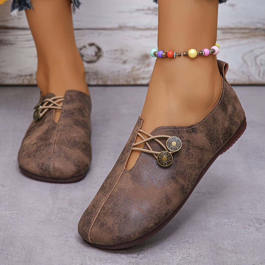 Dark brown suede-look button slip-on flats with lace-up vamp and two button medallions