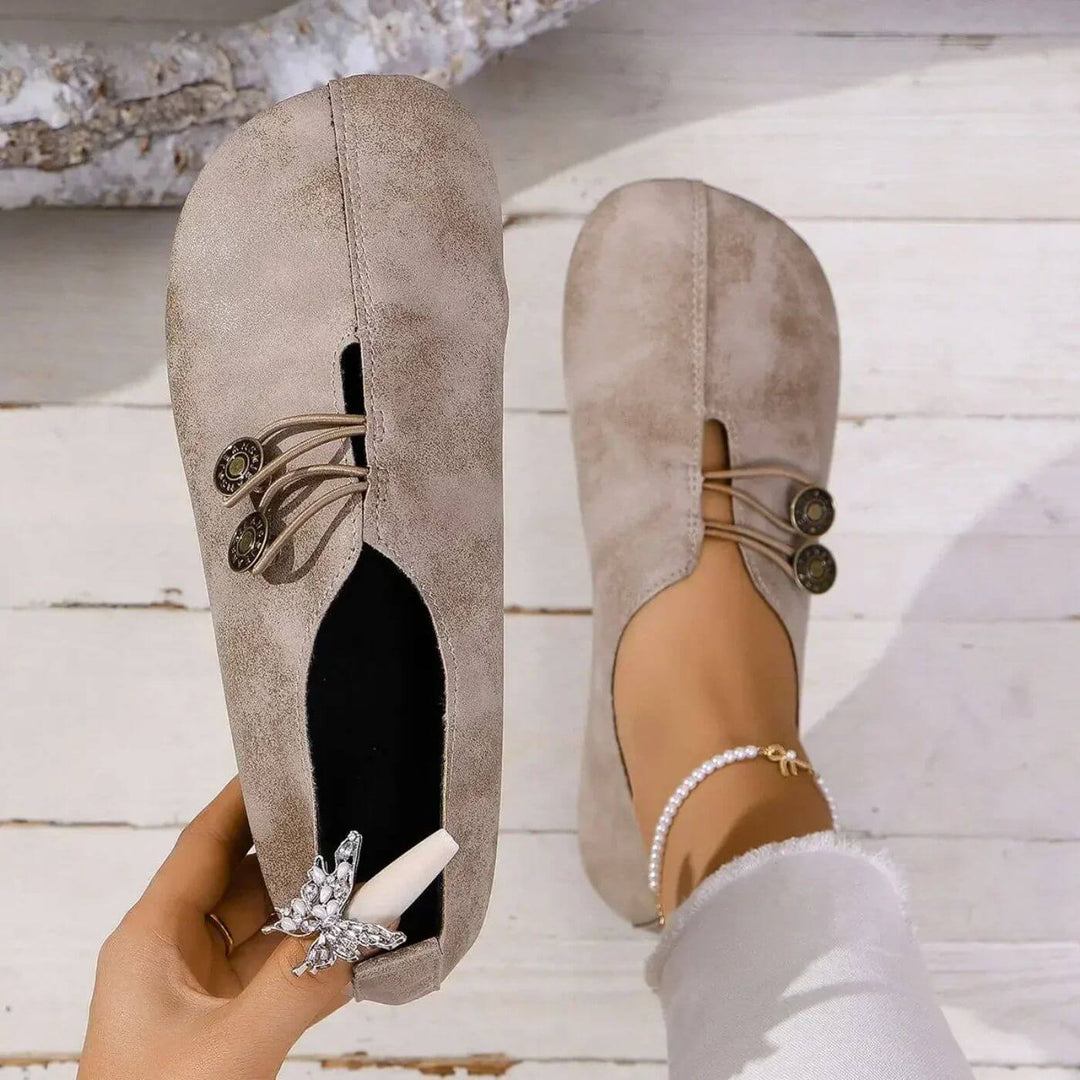 Light brown button slip-on flats with lace-up vamp and decorative button detail