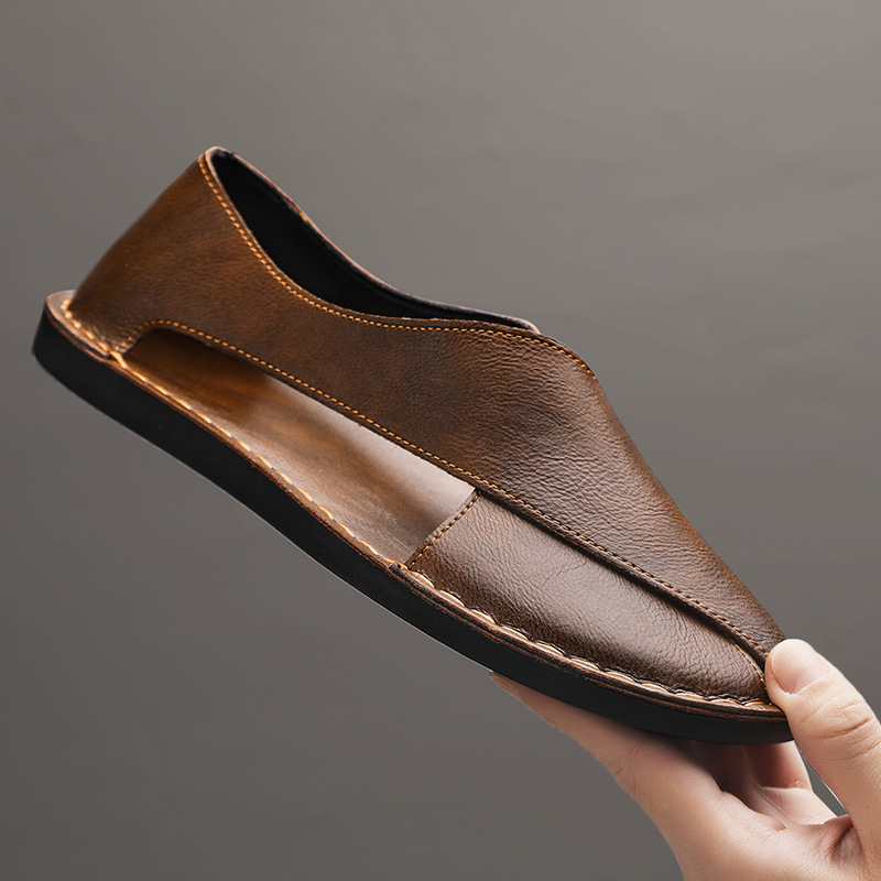 Brown leather open-toe slide sandal, front view with V strap and dark rubber sole.