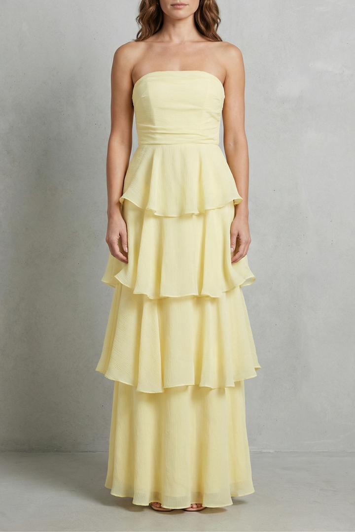 Light yellow strapless tiered maxi dress with layered ruffle skirt