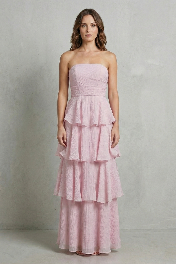 Light pink strapless tiered maxi dress with ruched bodice and layered ruffles