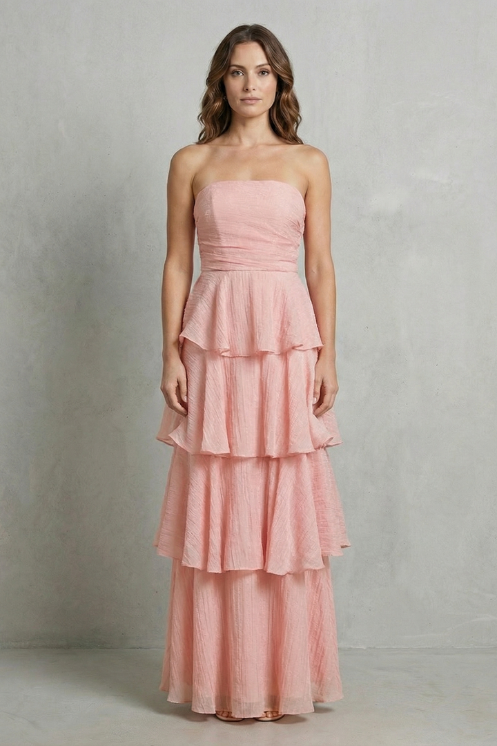 Light pink strapless tiered maxi dress with peplum-style ruffle tiers
