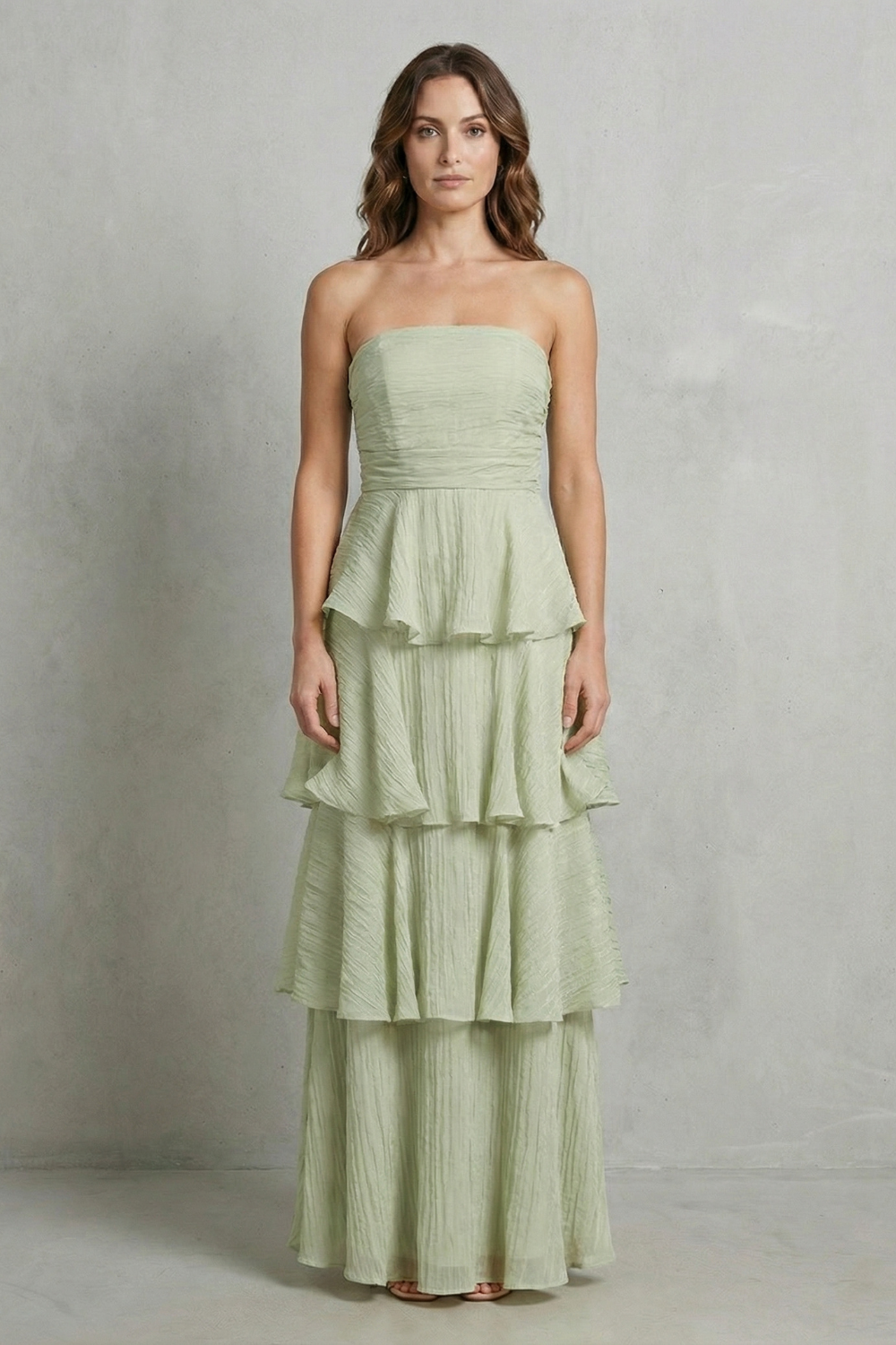 Light green strapless tiered maxi dress with peplum-style ruffle tiers
