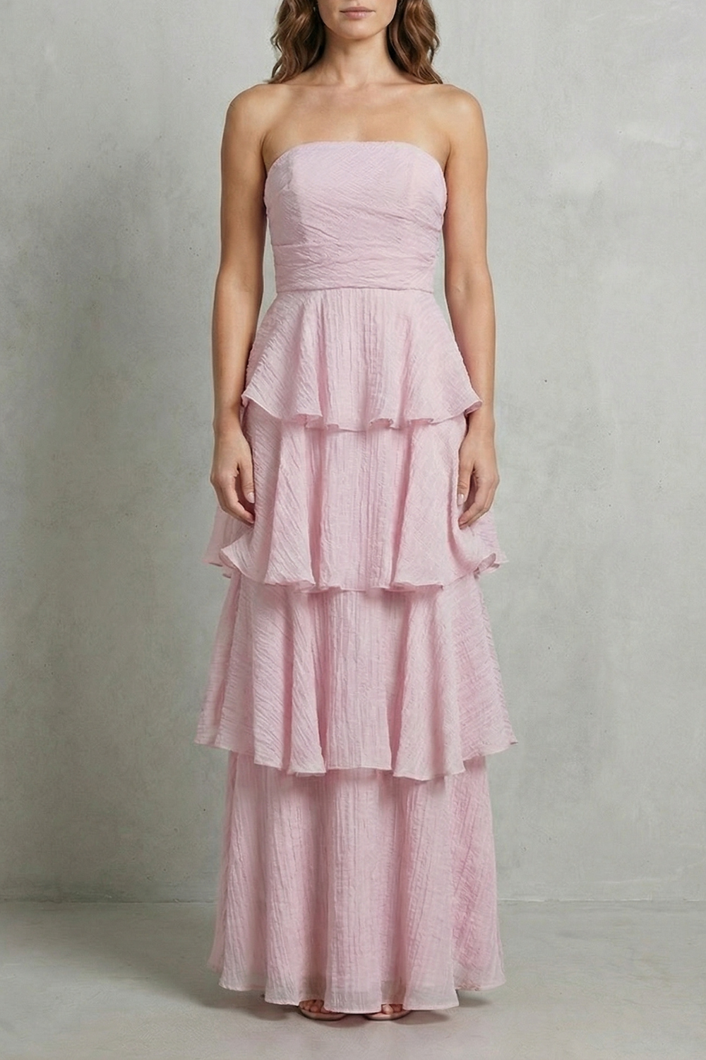 Light pink strapless tiered maxi dress with ruffled layered skirt