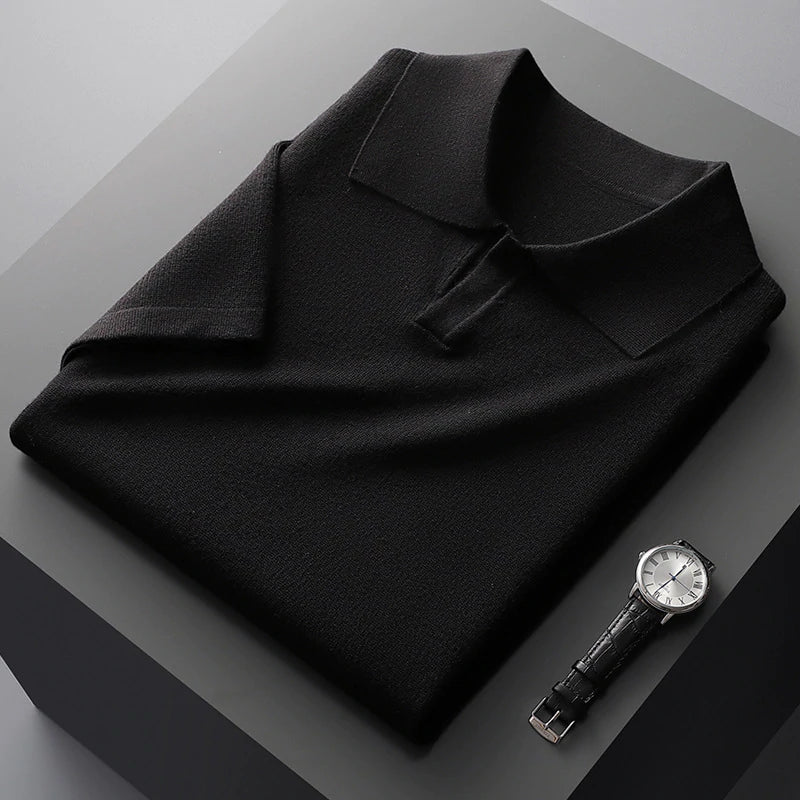 Folded black cotton polo shirt with wide collar and short sleeves