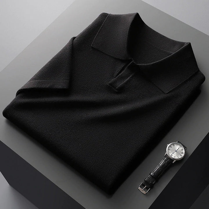 Folded black cotton polo shirt with wide collar and short sleeves
