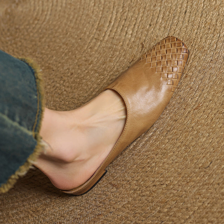 Women’s woven flat mules, tan open-back with braided weave at the vamp