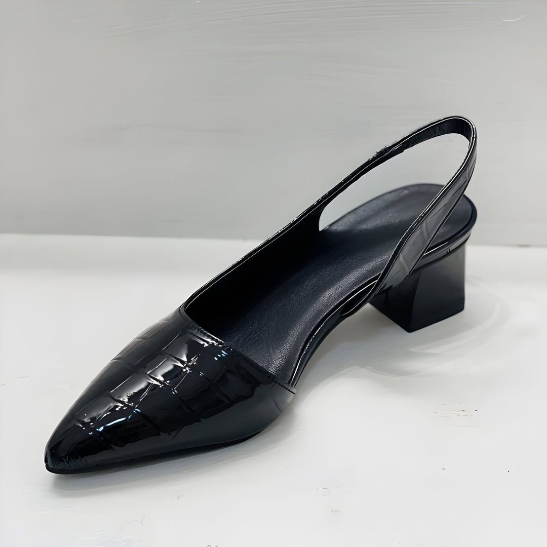 Black pointed-toe slingback flats with glossy leather upper and block heel
