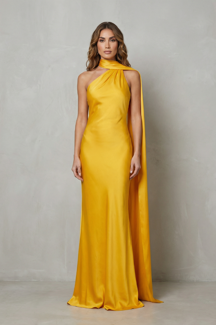 Yellow satin mermaid gown with sleeveless halter neckline and flowing side drape