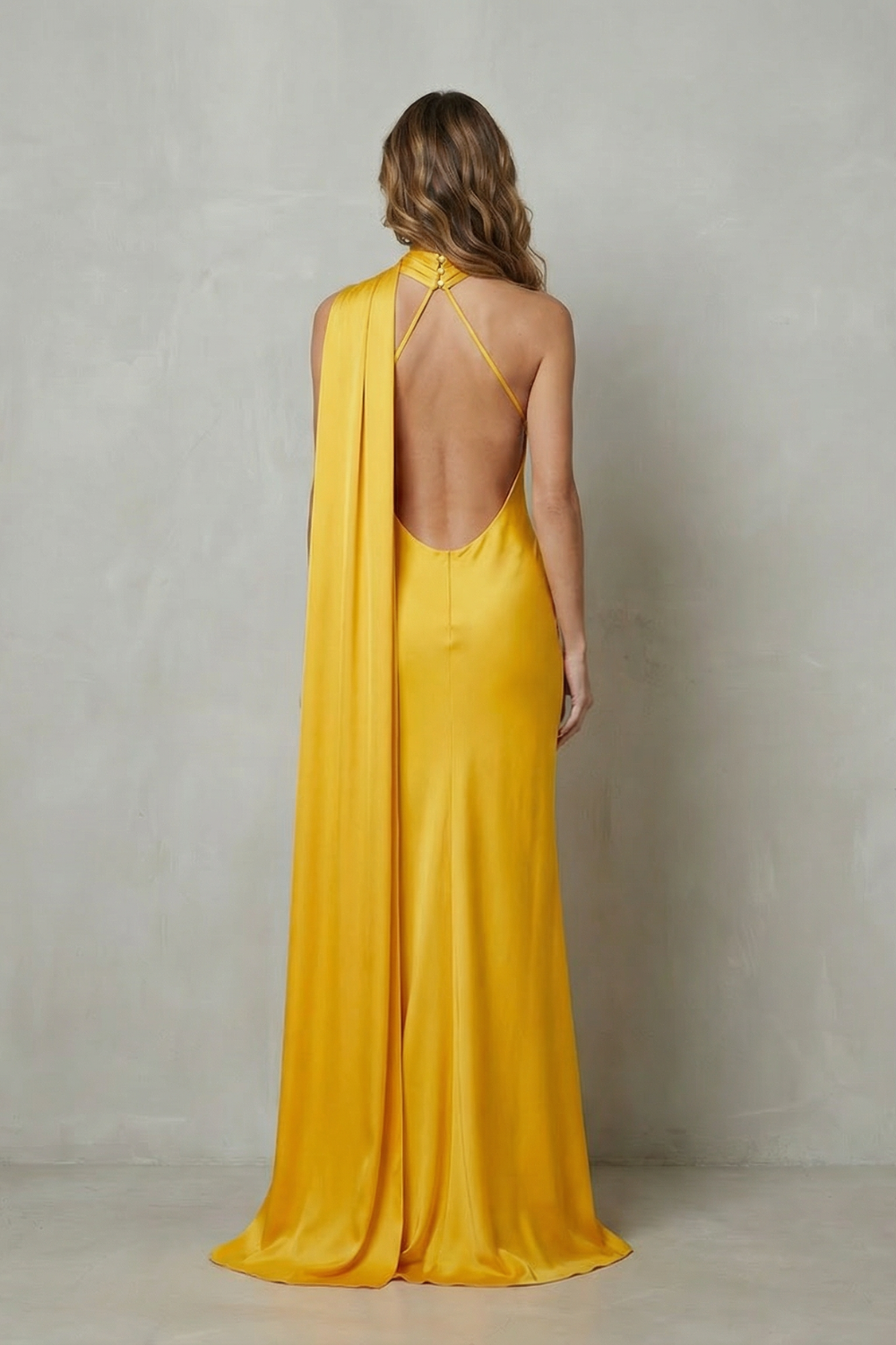 Yellow satin mermaid gown back view with halter tie and open back detail